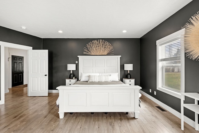 3201 12th St NE, Great Falls, MT 59404 - bedroom with baseboards, visible vents, and light wood-style flooring