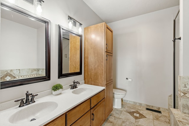 3201 12th St NE, Great Falls, MT 59404 - full bathroom with double vanity, toilet, visible vents, and a sink