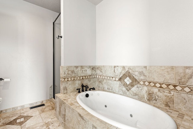 3201 12th St NE, Great Falls, MT 59404 - bathroom with visible vents, a stall shower, toilet, and a jetted tub