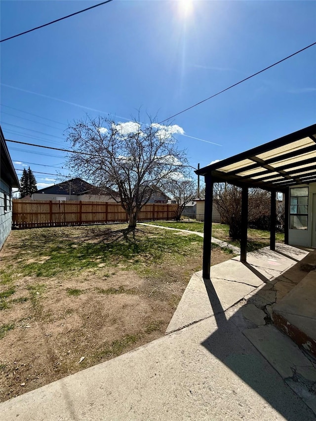 view of yard featuring a patio and fence