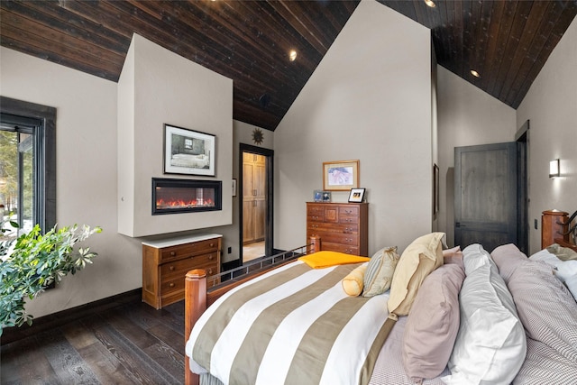 bedroom featuring wood ceiling, baseboards, high vaulted ceiling, dark wood-style floors, and a glass covered fireplace