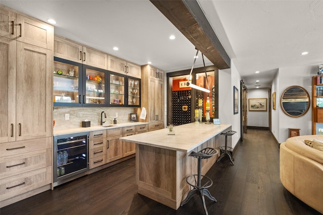 bar featuring wine cooler, indoor wet bar, and dark wood-type flooring