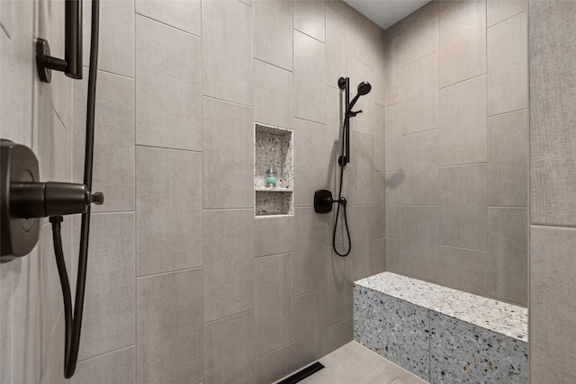 full bath with tiled shower
