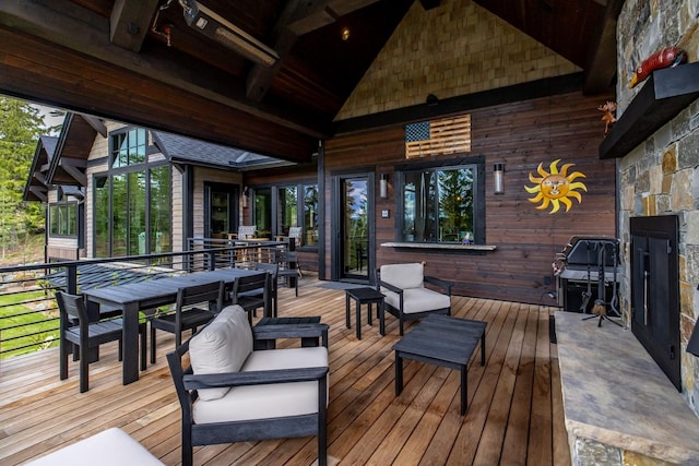 deck with outdoor dining area and an outdoor hangout area
