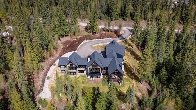 bird's eye view featuring a forest view