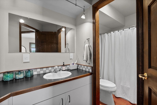 128 River View Dr, Kalispell, MT 59901 - full bath featuring vanity, wood finished floors, and a shower with shower curtain