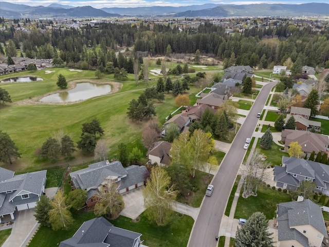 128 River View Dr, Kalispell, MT 59901 - aerial view of property and surrounding area featuring nearby suburban area and a water and mountain view