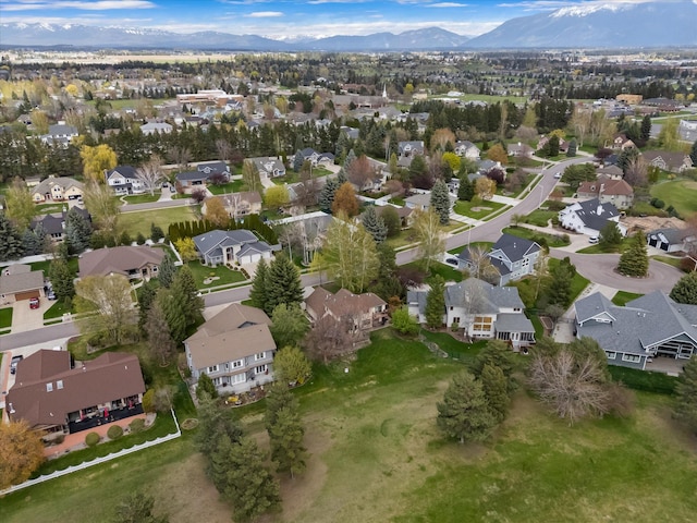 128 River View Dr, Kalispell, MT 59901 - aerial view of property's location featuring a mountain backdrop and nearby suburban area
