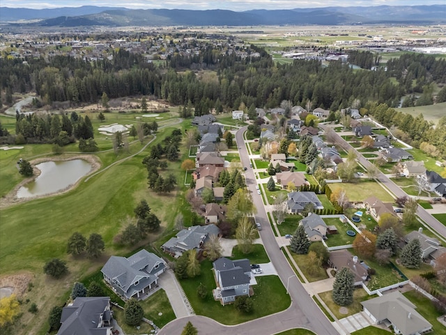 128 River View Dr, Kalispell, MT 59901 - aerial overview of property's location with nearby suburban area and a water and mountain view