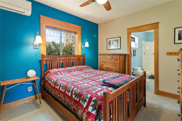 carpeted bedroom featuring baseboards, ceiling fan, a wall mounted air conditioner, and connected bathroom
