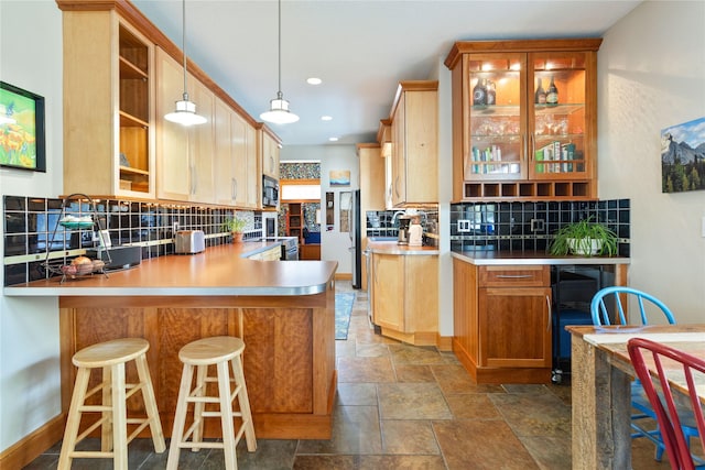 kitchen featuring open shelves, recessed lighting, tasteful backsplash, stone finish flooring, and appliances with stainless steel finishes