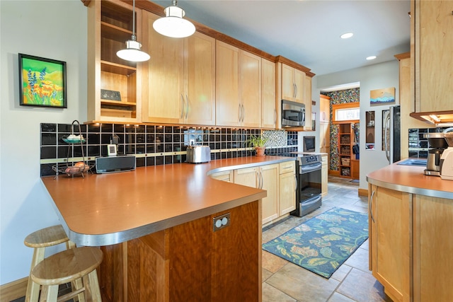 kitchen featuring light brown cabinetry, appliances with stainless steel finishes, tasteful backsplash, and a peninsula