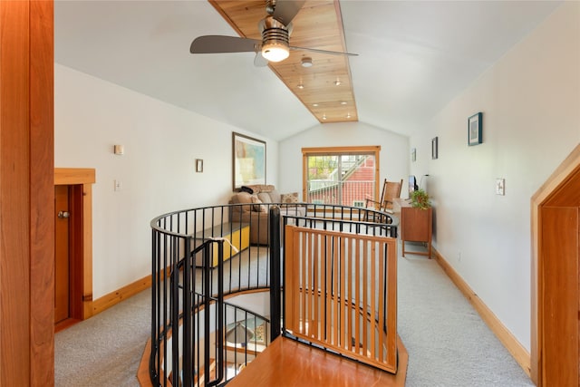 corridor featuring an upstairs landing, carpet floors, baseboards, lofted ceiling, and recessed lighting