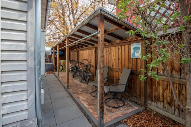 view of patio featuring fence