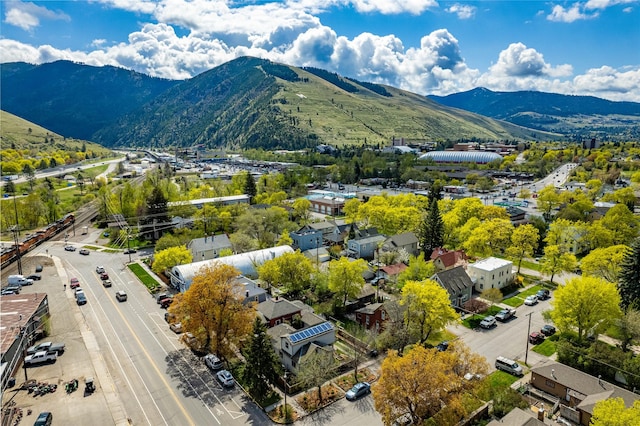 birds eye view of property with a mountain view