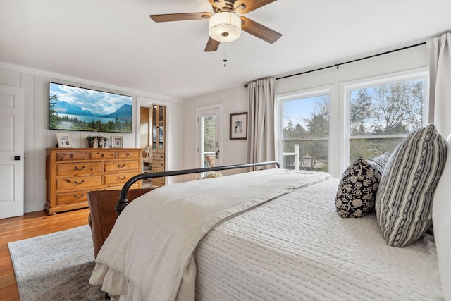 bedroom with ceiling fan and light wood-style floors