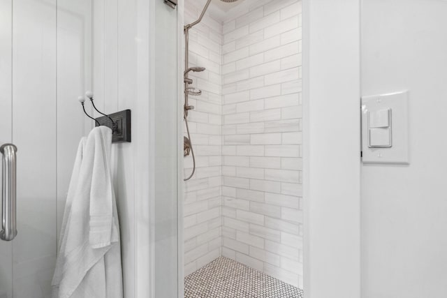 bathroom featuring a shower stall