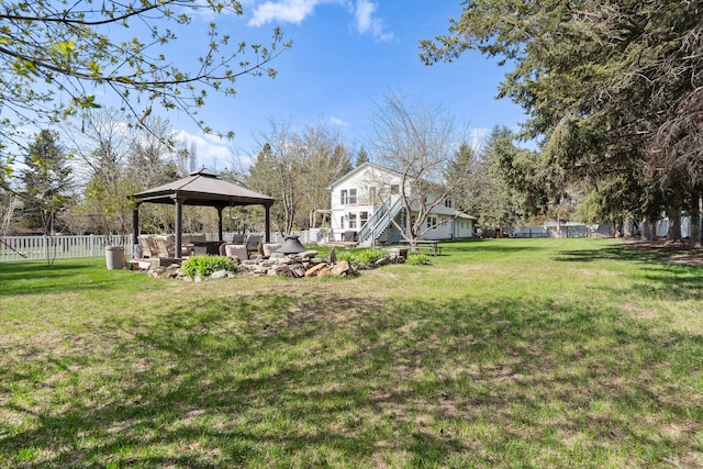 view of yard featuring a gazebo, outdoor lounge area, and a fenced backyard