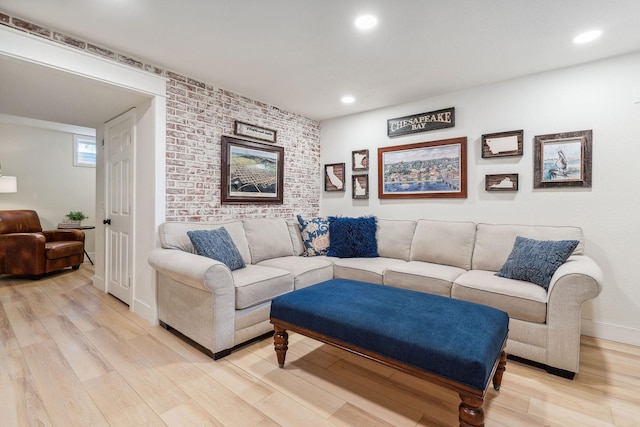 living area featuring light wood-type flooring, recessed lighting, and baseboards