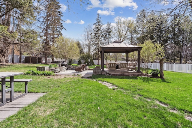 surrounding community featuring a fenced backyard, a gazebo, and a yard