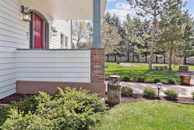 view of yard featuring covered porch