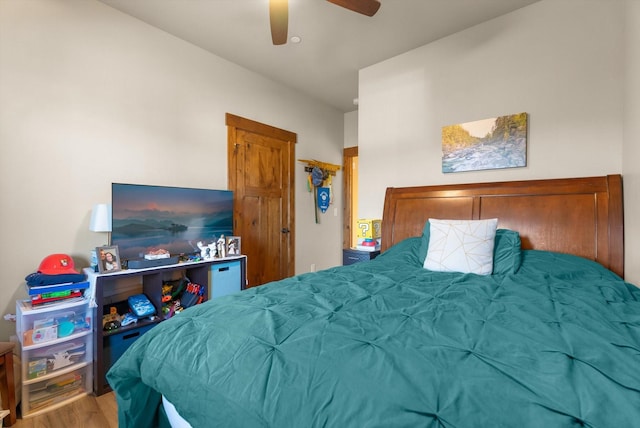bedroom with ceiling fan and wood finished floors