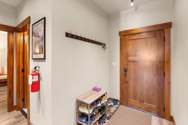 doorway with light wood-type flooring