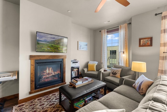 519 Nucleus Ave Unit 303, Columbia Falls, MT 59912 - living room featuring wood finished floors, a glass covered fireplace, and ceiling fan
