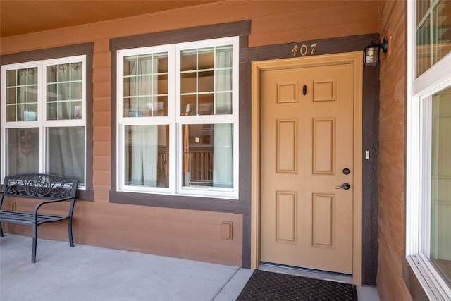 doorway to property featuring a porch