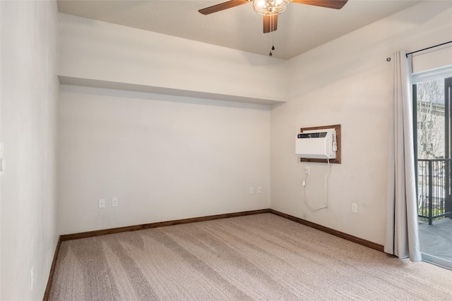 empty room with a ceiling fan, baseboards, light carpet, and a wall unit AC