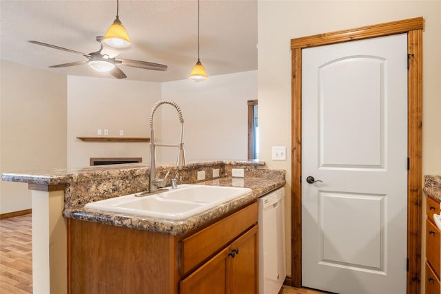 bathroom with a ceiling fan, wood finished floors, and vanity