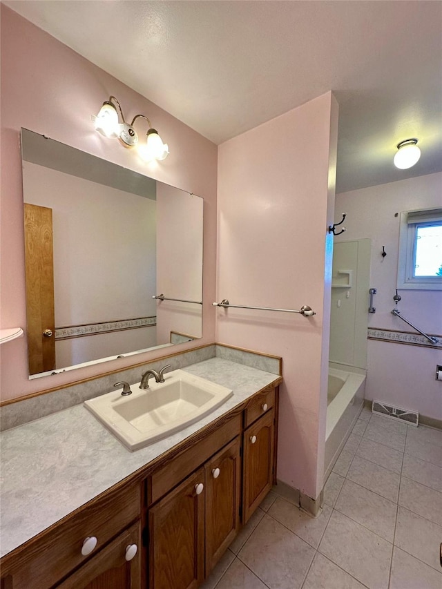 full bath with shower / bathing tub combination, tile patterned flooring, and vanity