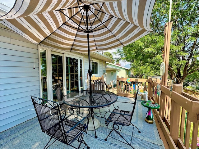 wooden deck with outdoor dining area