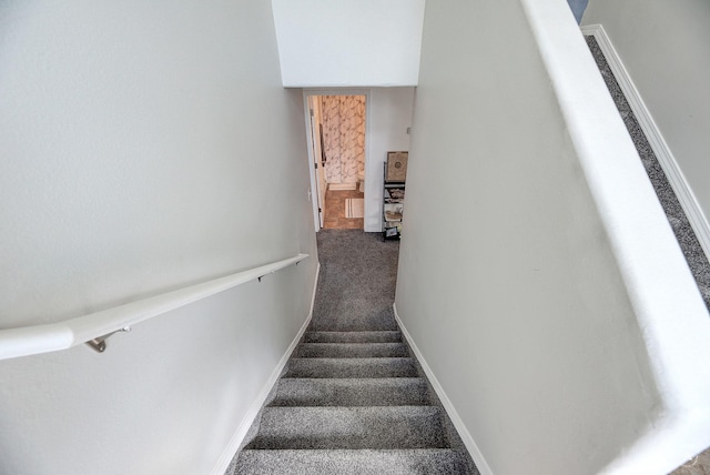 staircase with carpet flooring and baseboards