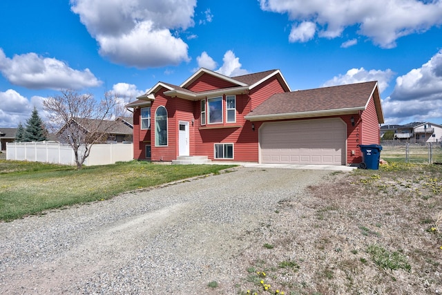 view of front of property with a garage, a front lawn, fence, a shingled roof, and driveway