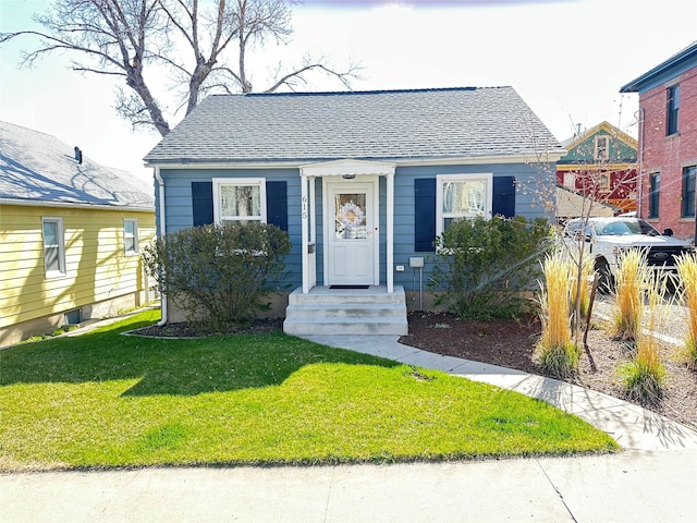 615 Dearborn Ave Unit 320Power, St, Helena, MT 59601 - bungalow-style home featuring a shingled roof and a front yard