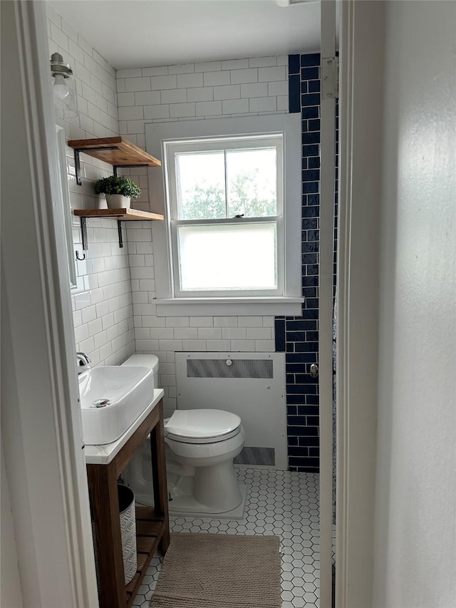 615 Dearborn Ave Unit 320Power, St, Helena, MT 59601 - bathroom featuring vanity, toilet, tile patterned floors, radiator, and tile walls