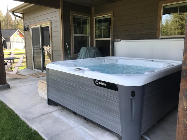 view of patio with a hot tub
