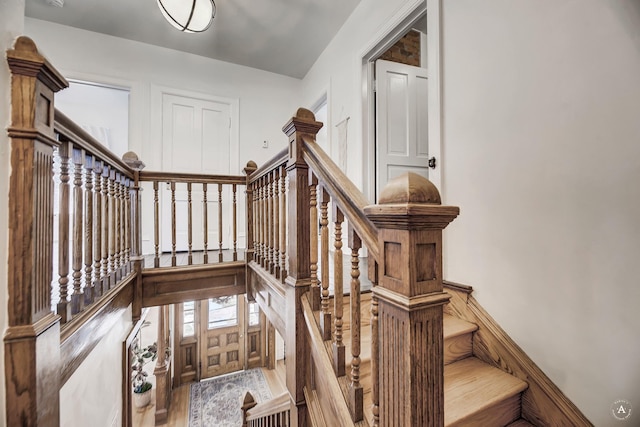 stairway featuring wood finished floors