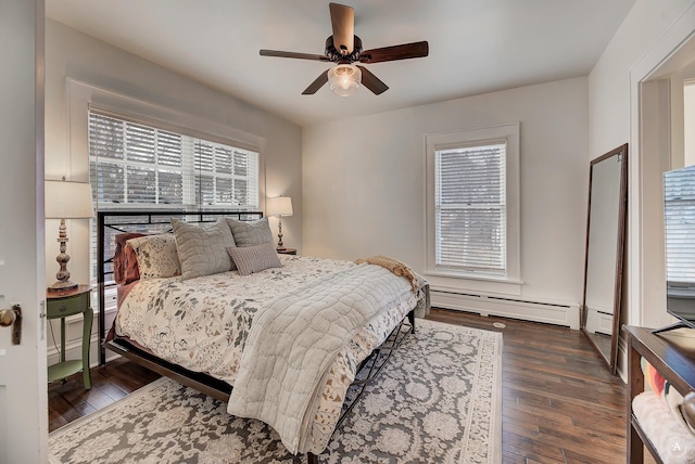 bedroom featuring a baseboard radiator, a ceiling fan, wood finished floors, and baseboard heating
