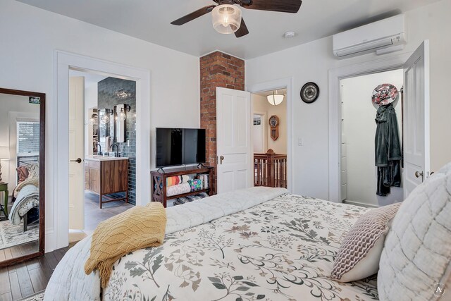320 Power St, Helena, MT 59601 - bedroom featuring connected bathroom, a wall mounted air conditioner, wood-type flooring, a ceiling fan, and a closet
