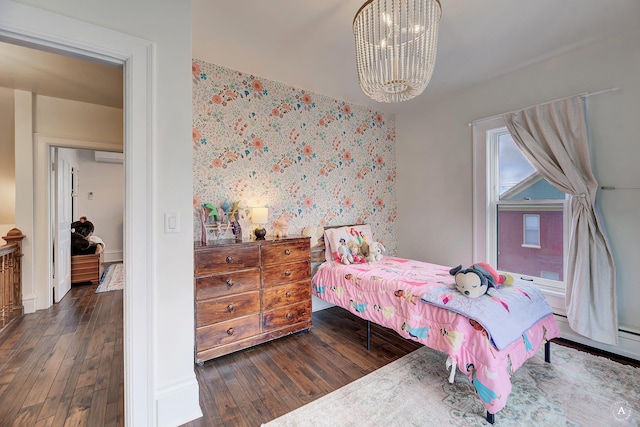 bedroom featuring an inviting chandelier, wood-type flooring, and wallpapered walls