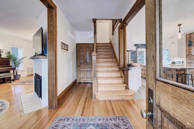 320 Power St, Helena, MT 59601 - stairway with a fireplace with flush hearth and wood finished floors