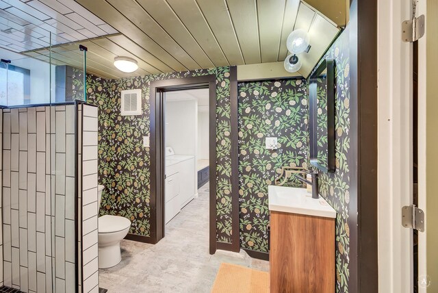 320 Power St, Helena, MT 59601 - bathroom featuring visible vents, vanity, toilet, wallpapered walls, and washer and clothes dryer