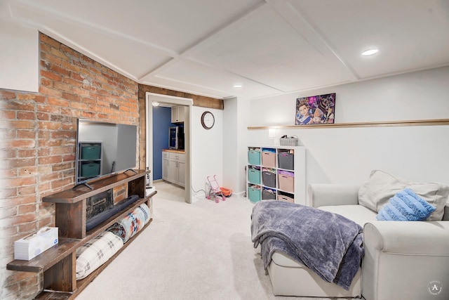 bedroom featuring carpet and brick wall