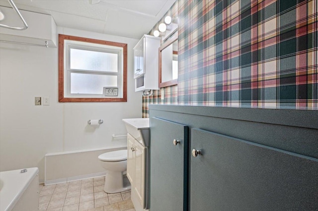 full bathroom with vanity, baseboards, tile patterned floors, and toilet