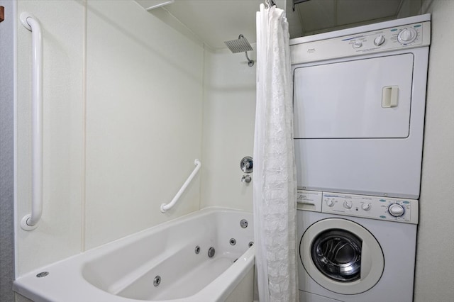 full bath featuring a combined bath / shower with jetted tub and stacked washer and clothes dryer
