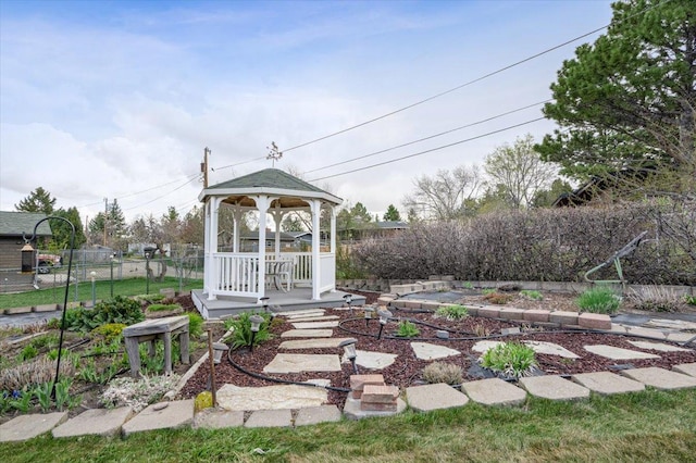 view of yard featuring fence and a gazebo