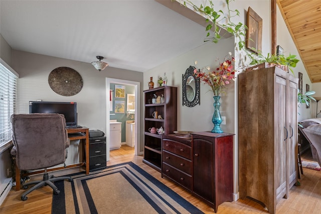 office space with a baseboard radiator and wood finished floors
