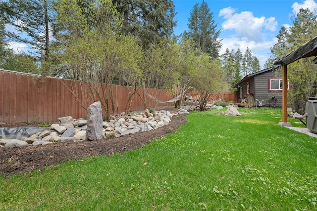 view of yard with a fenced backyard